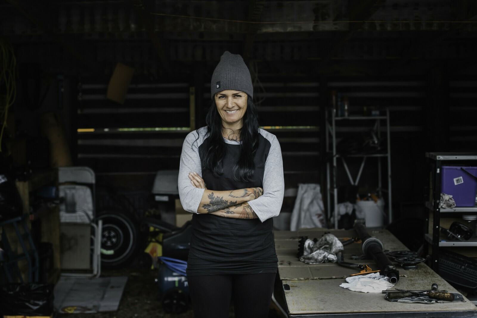 A woman standing in the bicycle workshop she runs